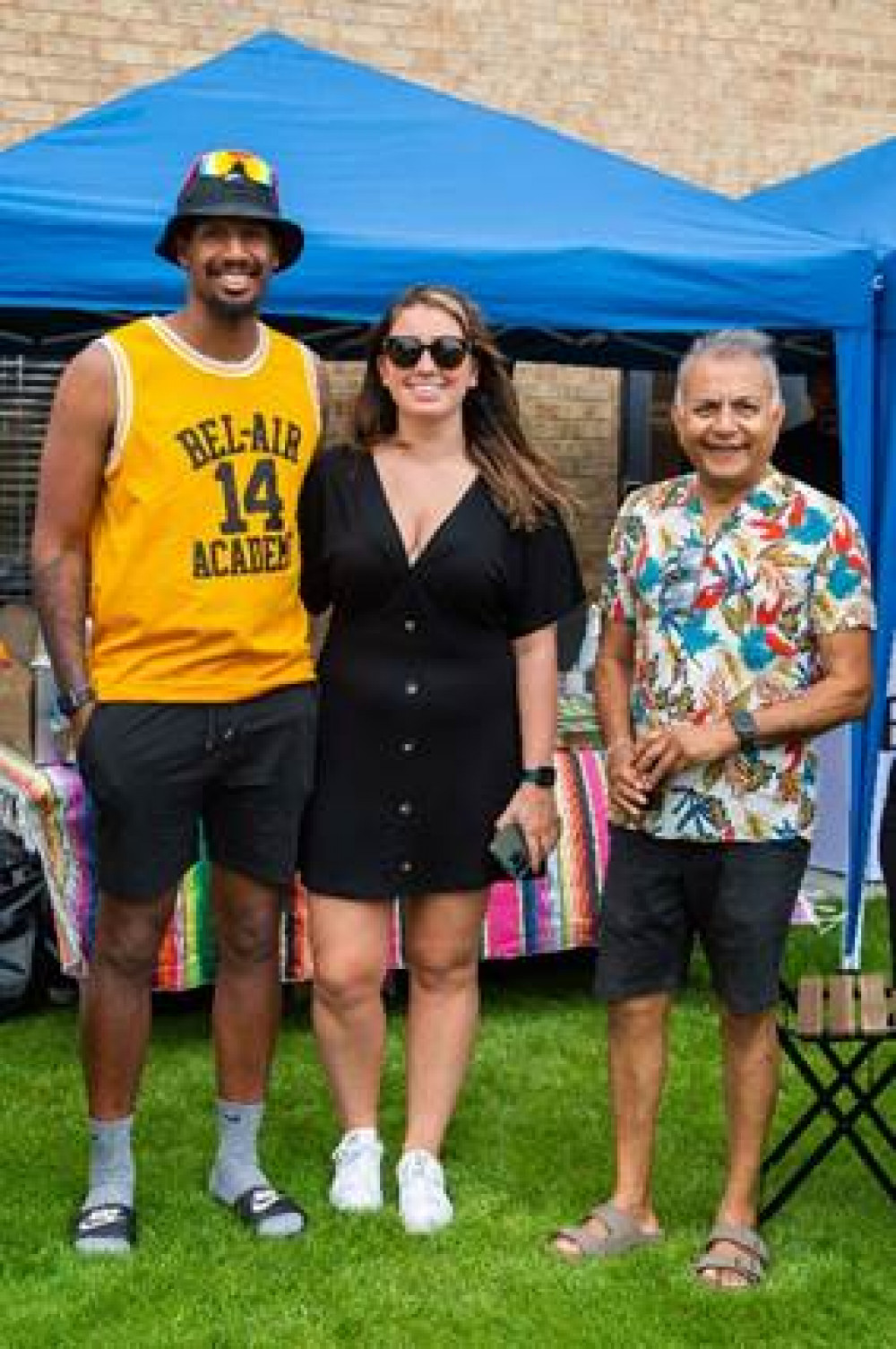 Residents Aaron and Jessica Harrison and Satish Valera enjoy the barbecue social event at Bellway’s Maple Creek development in Fobbing.