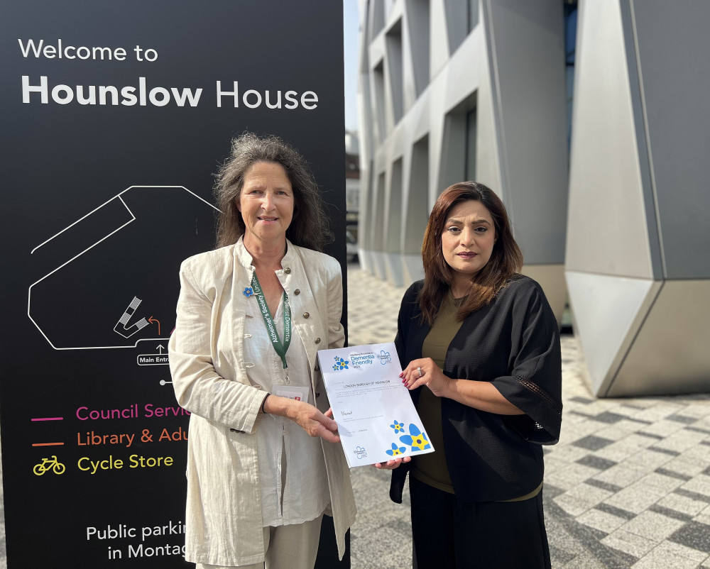  Kate Sergeant from The Alzheimer's Society presents the dementia-friendly certificate to Hounslow Council's Cabinet Member for Adult Social Care, Public Health and Transformation, Councillor Samia Chaudhary (credit: Hounslow Council)..