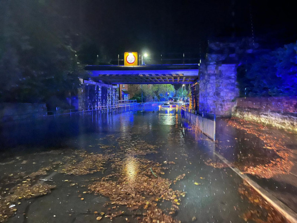 Tamworth Road under the railway bridge was flooded early on Monday morning - with a car trapped by the deep water. Photo: Ashby Fire Station