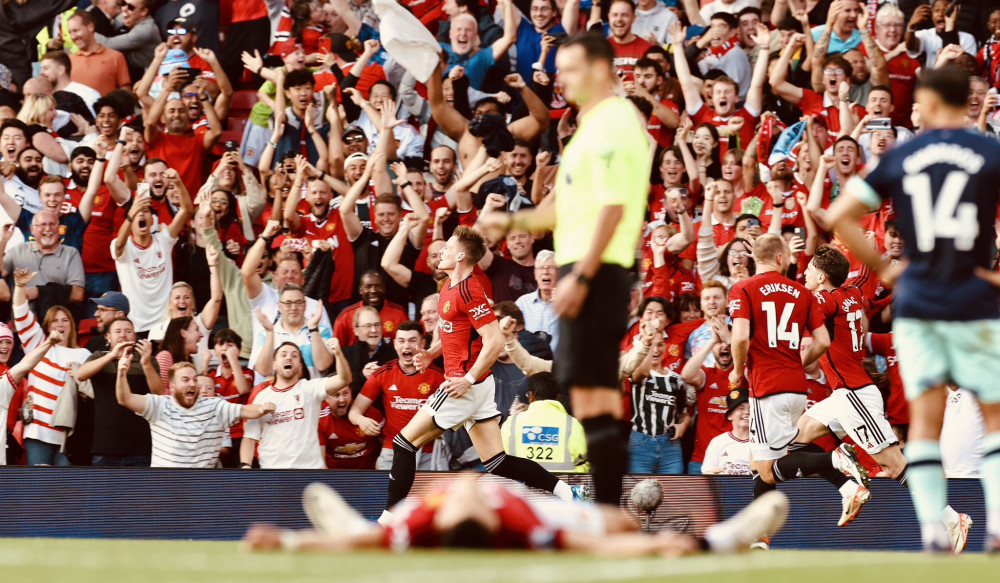 Manchester United celebrating Scott McTominay's 96' minute goal to complete United's comeback against Brentford (credit: Manchester United/X). 