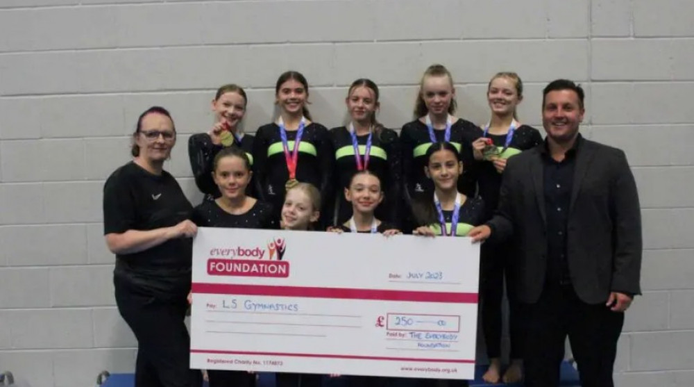 Thomas Barton Everybody Health & Leisure CEO presenting grant cheque to Candy Lakin & LS Gymnastics from the Everybody Foundation (image supplied)