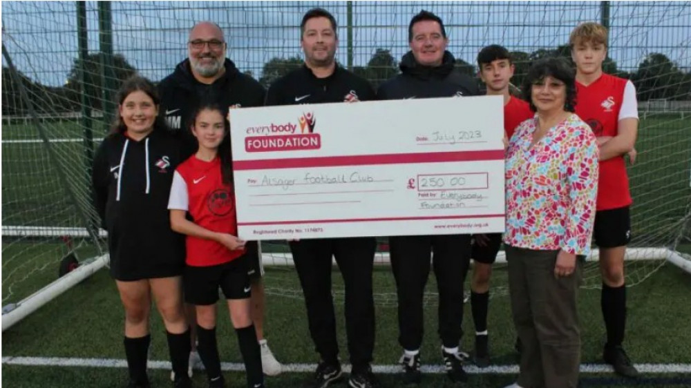 Everybody Foundation Trustee Kimiyo Rickett presenting Andrew Miller and AFC Alsager their grant from the Everybody Foundation (image supplied)