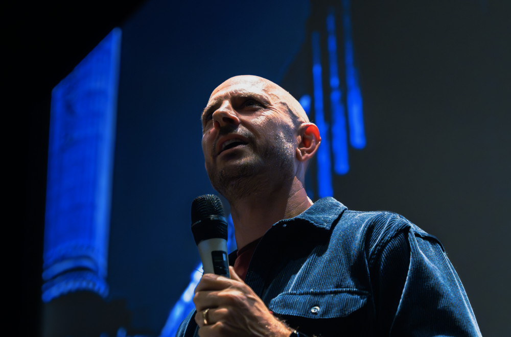 Director Sam Cullis introduces festival to packed audience at Battersea Powerstation