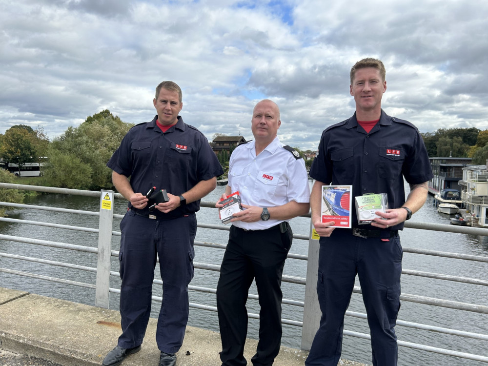 Firefighter Matt Clark, left, Richmond Borough Commander Rob Davies, and Firefighter Rhodri Davies on a bridge leading onto Tagg's Island. (Photo: London Fire Brigade).