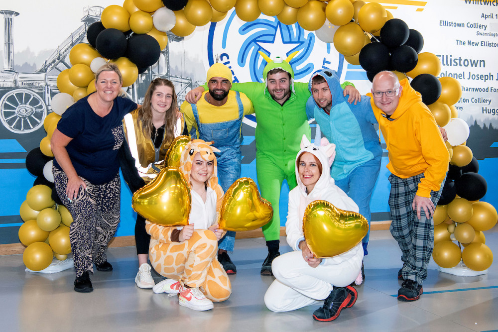 Amazon BHX2 Goes Gold and wears pyjamas to work to raise awareness of International Childhood Cancer Awareness Month. Photos: Supplied