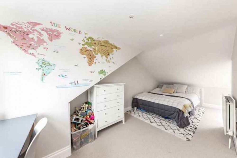 A cosy loft room with double bed and sloping ceiling