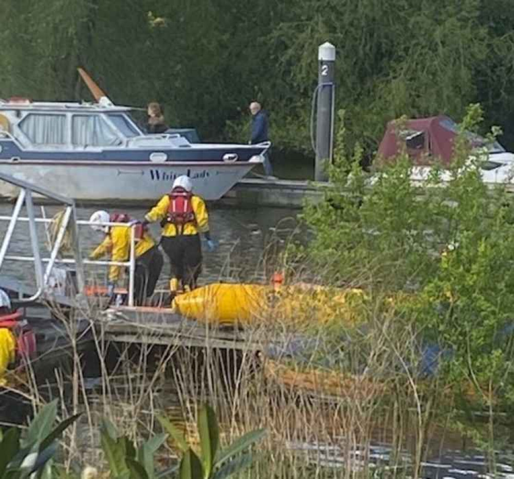 The RNLI used yellow inflatables to get to the whale which was in a state of distress