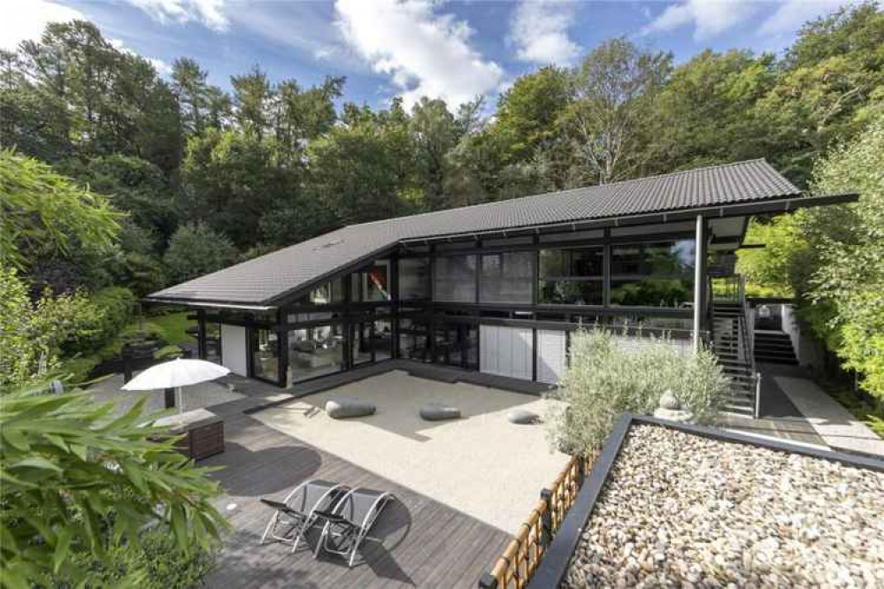 The house maintains privacy with automatic blinds