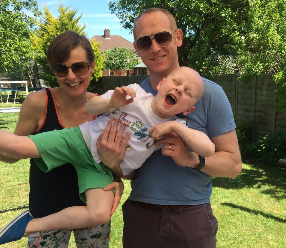 Parents Jenny and Steve with their son Lewis on the day they received the news he was in remission in June 2016. (Photo Credit: Jenny Houghton).