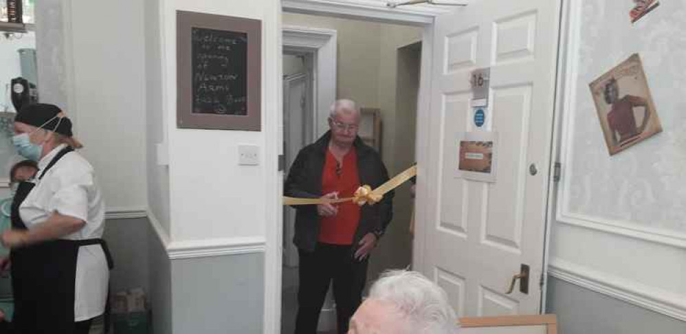 A resident cuts the ribbon, marking the official opening of The Newton Arms, Image: Newton Hall Care Home A resident cuts the ribbon, marking the official opening of The Newton Arms, Image: Newton Hall Care Home