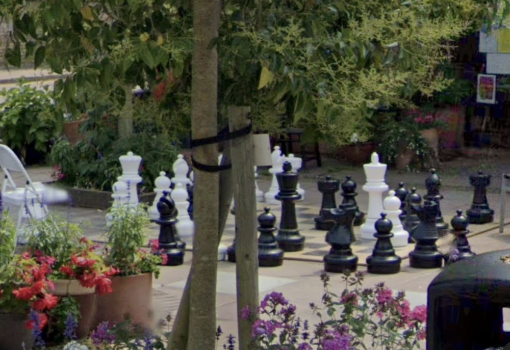 The white queen has been stolen from the Church Street chess board. (Photo Credit: Google Maps).