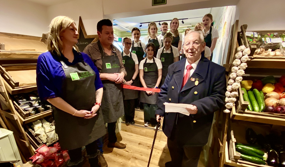 Lil Bo's owners Steve and Deborah Evans, and staff, watch on as former Ashby Mayor, Graham Allman, officially opens the Mill Lane Mews Deli. All photos: Ashby Nub News Lil Bo's owners Steve and Deborah Evans, and staff, watch on as former Ashby Mayor, Graham Allman, officially opens the Mill Lane Mews Deli. All photos: Ashby Nub News
