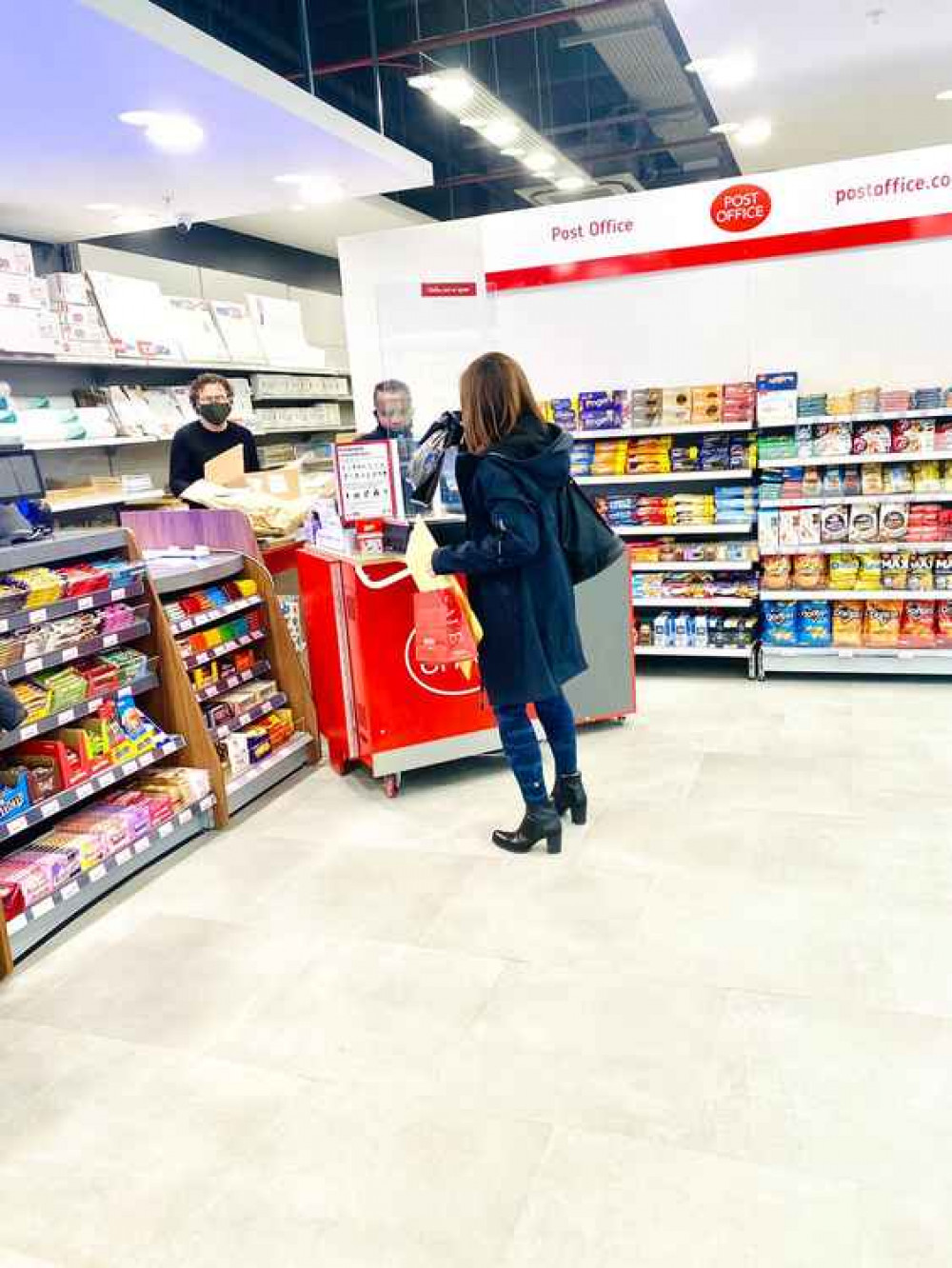 Checking out the new counters. The town centre post office will be open late on Thursdays but closes early on Sundays (Credit: Kingston First)