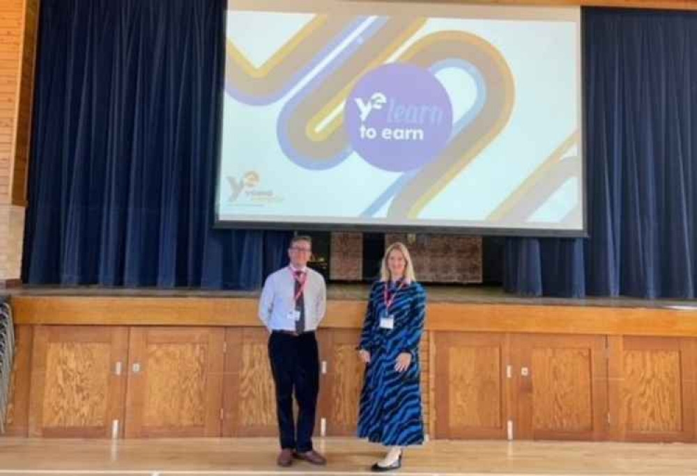 Katie Lovatt and Christopher Hirsch from Holland Hahn & Wills helped run a 'learn to earn' session at St Catherine's school in Twickenham (Credit: Holland Hahn