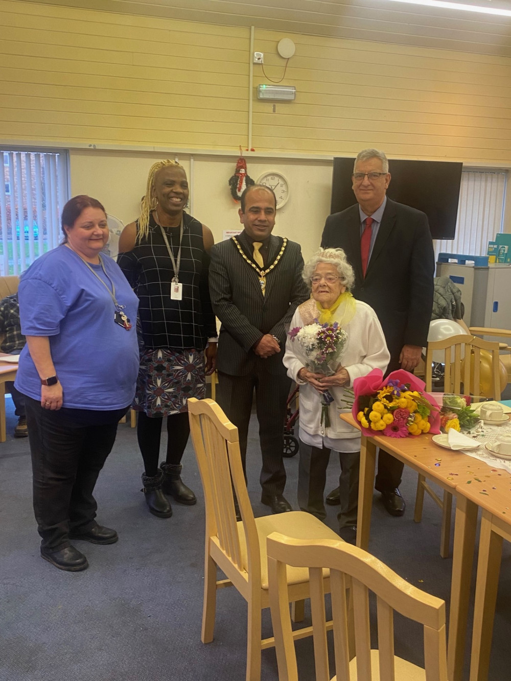 Mary with housing and community care staff and supporters. 