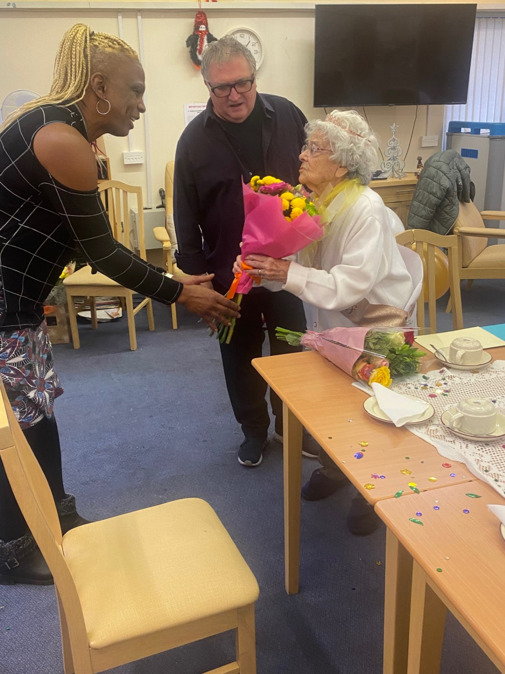 Sam Edward presented Mary with a bouquet.