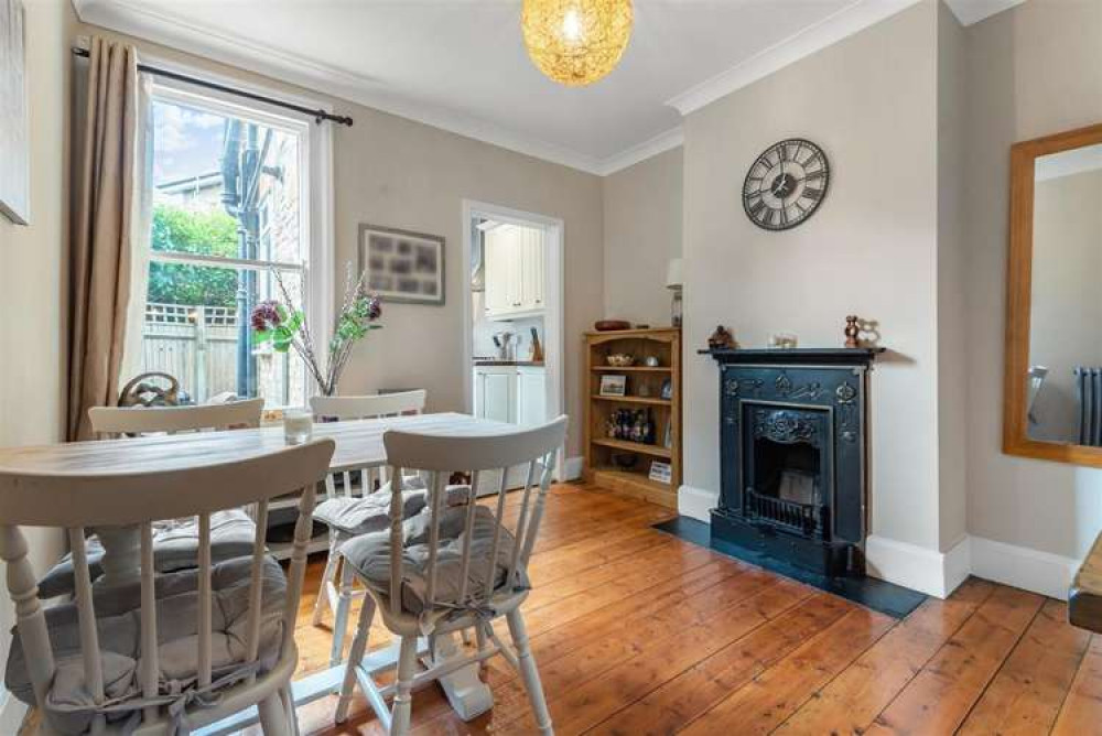 The dining room has a period fireplace and plenty of light (Image: Matthew James)