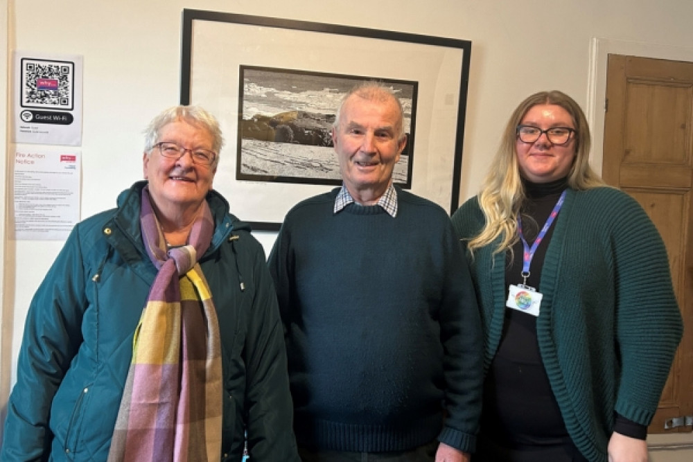 Photo shows Molly Whittock, Clinical Services Administrator at We Hear You receiving the donation from Mr and Mrs Hughes.  