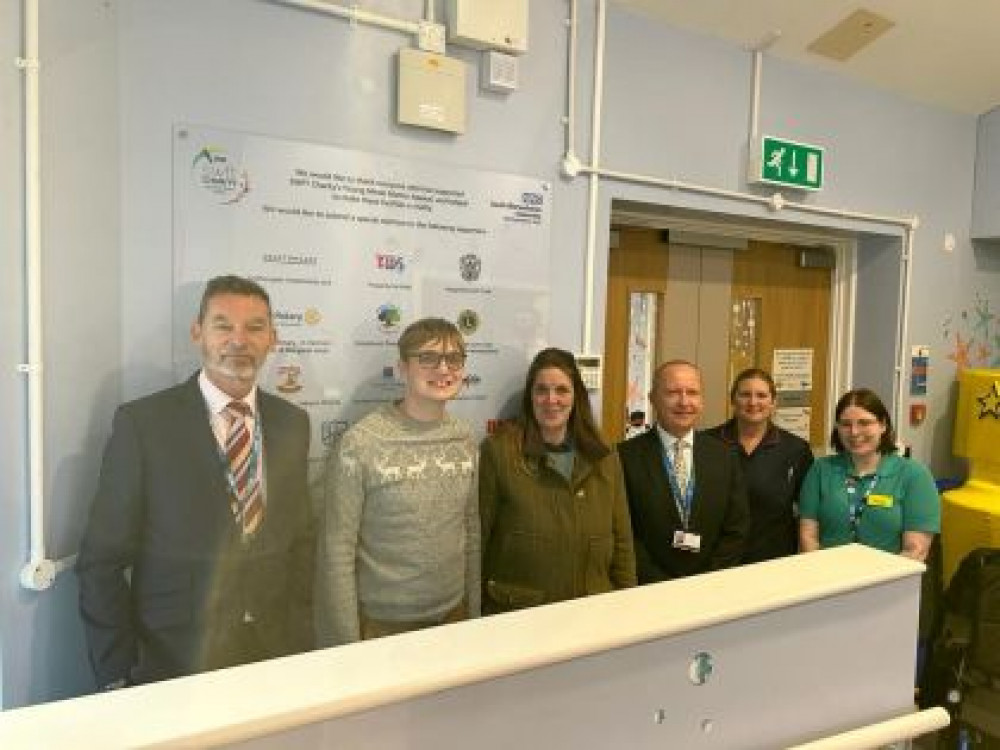 From left - Russell Hardy, SWFT Chair, Joseph and Lucy Froggatt, Glen Burley, SWFT CEO, Debbie Sherwell Lead Paediatric Nurse and Freya Asker, Play Specialist (image via SWFT)