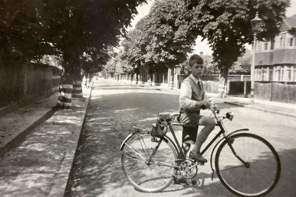 Roy grew up in Hampton and considered his neighbours friends. Pictured riding his bike as a boy (Image: Courtesy of Kingston Hospital)