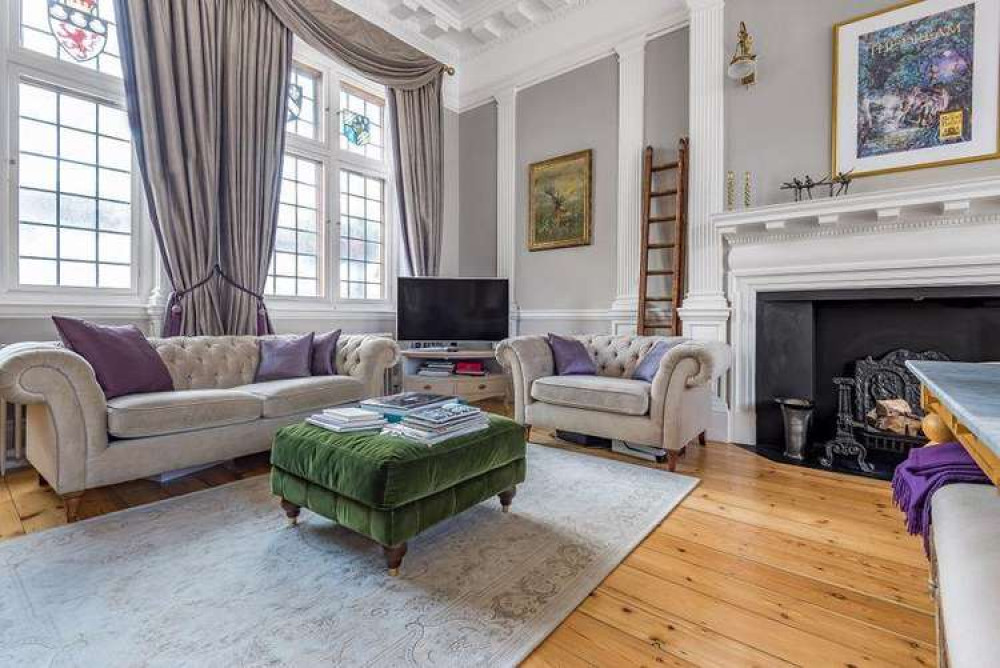 Columns, stained glass and feature fireplaces in the converted flat (Credit: Cocoon)