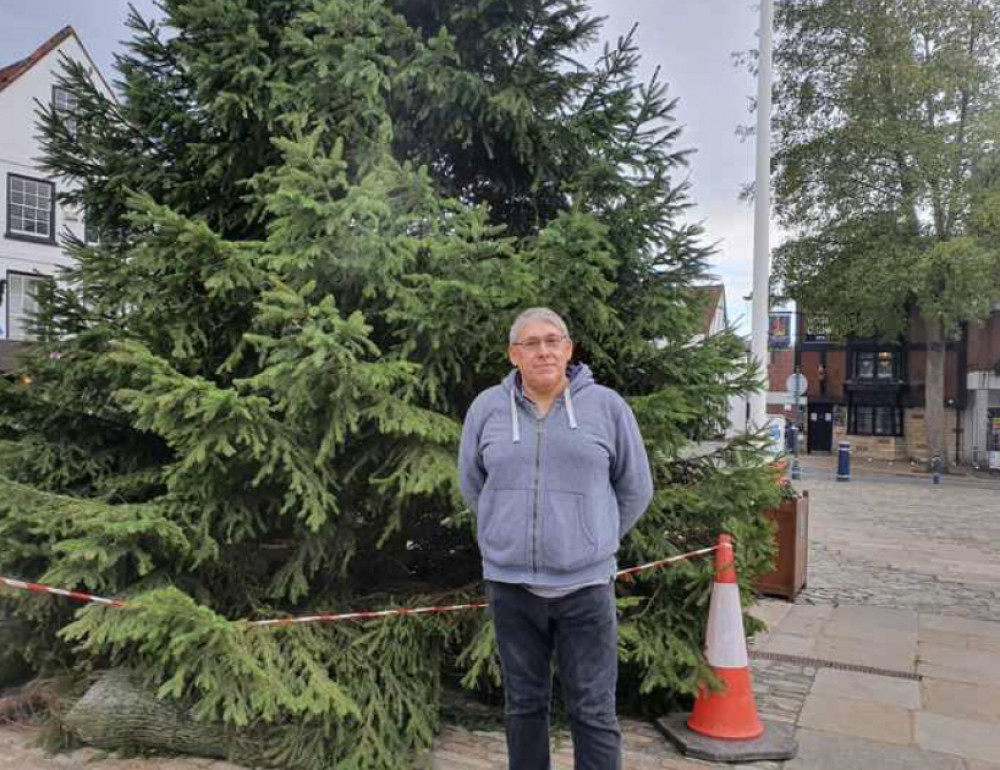 The moving story behind Hitchin's Christmas tree lights. PICTURE: Ian Albert in front of Hitchin's Christmas tree. CREDIT: Hitchin Nub News