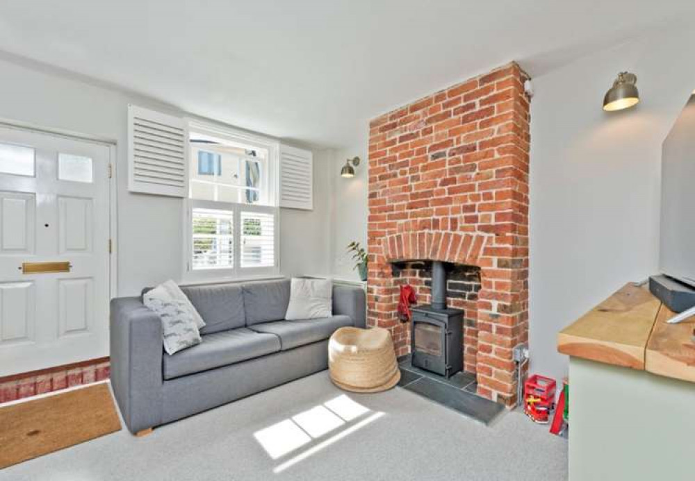 A log burner and fireplace make the living room cosy (Image: Seymours)