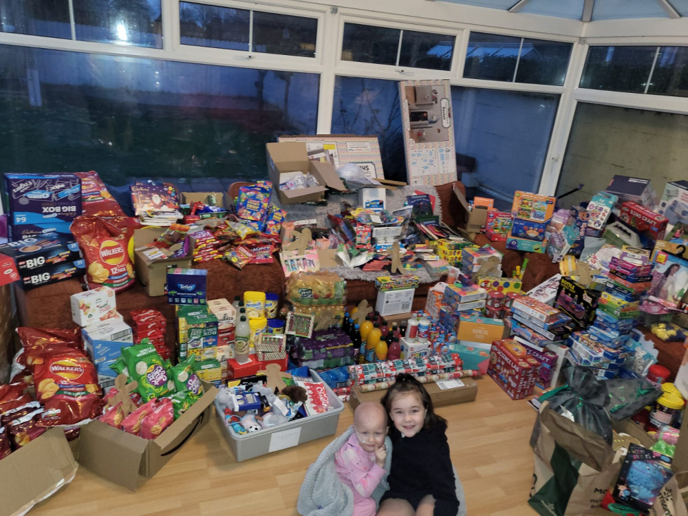 Dottie and Avery with some of the presents. 