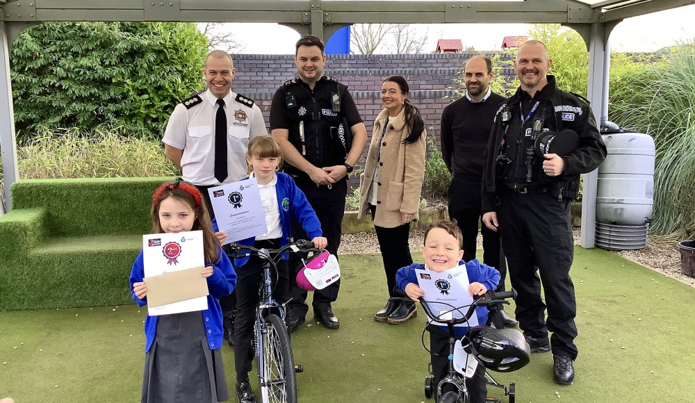 (Left to right top row) NWL District manager Fire and Rescue Jon Guest, NWL Deputy Commander SGT William Prince, NWL Community Safety Officer Jess Hill, Ward Councillor Andrew Woodman and NWL Commander Inspector Steve Burge; (Left to right bottom row) Key Stage 1 runner up Mabel, Key Stage 2 winner Lilly Rose, Key Stage 1 Winner James