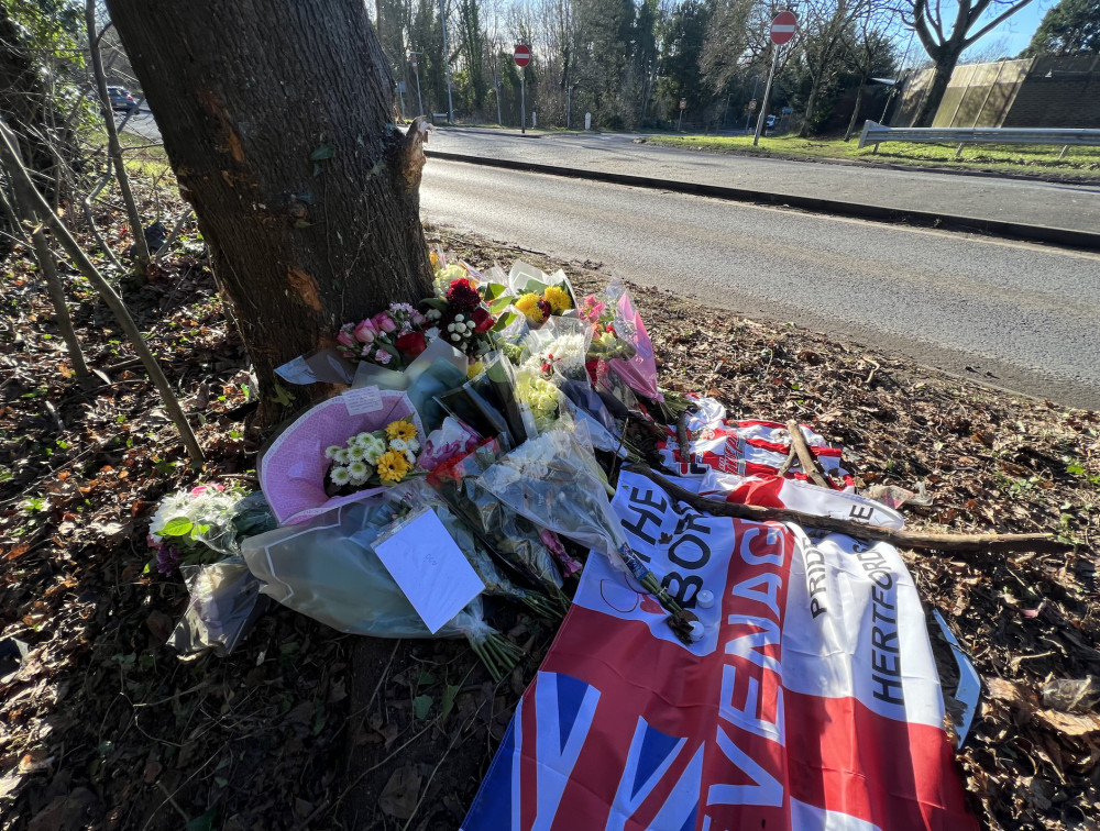 An ever-growing number of floral tributes and loving messages have been laid at the scene of the accident in Hitchin. CREDIT: Hitchin Nub News 