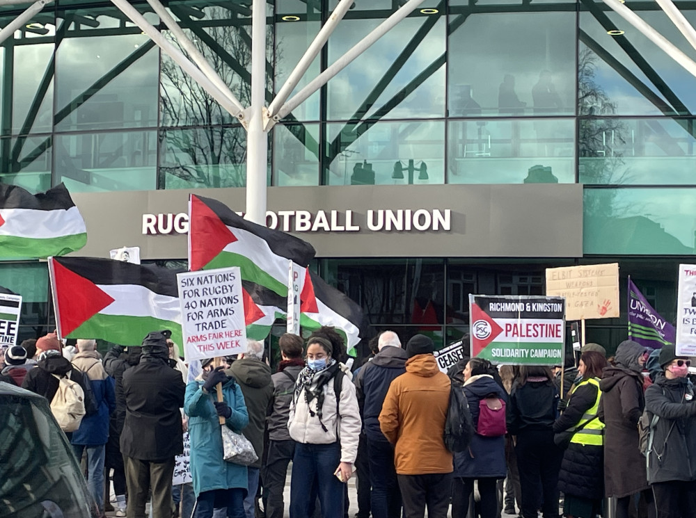 The protesters gathered outside of the stadium. (Photo Credit: Heather Nicholls).