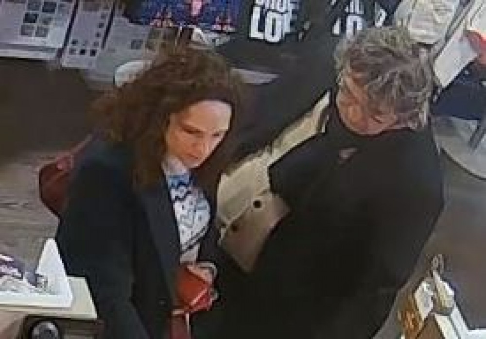 The woman in this CCTV footage put another woman's bag which was left in TX Maxx, Hanley, into her handbag (Staffordshire Police).