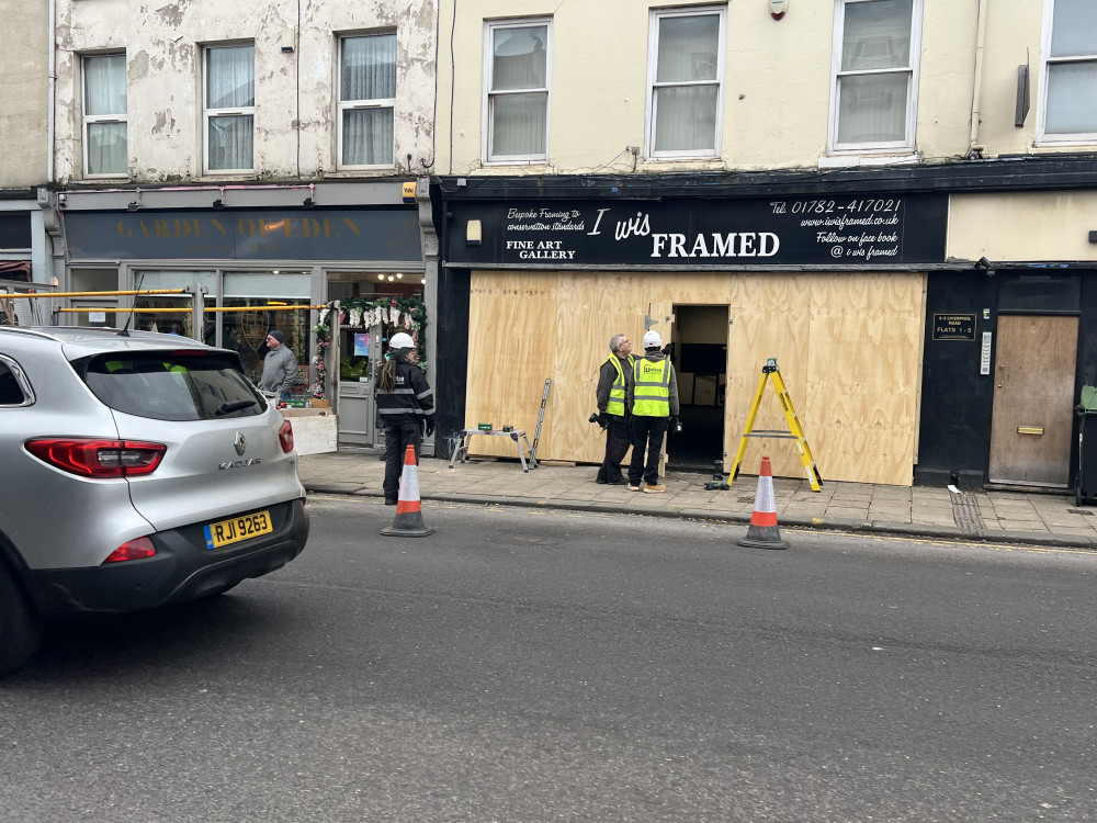 Contractors are currently boarding up the shop front of I Wis Framed on Liverpool Road (Nub News).