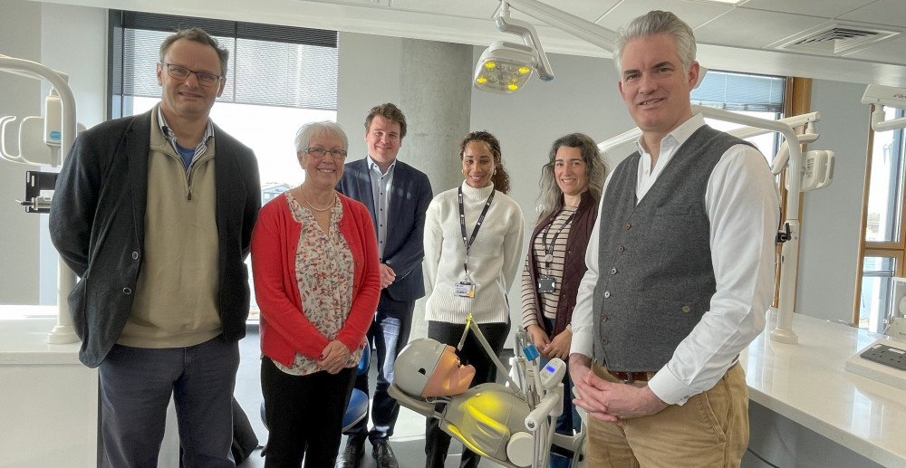 Dental Hygiene and Therapy lecturer Stacianne Tennant demonstrates the dental training facilities to, from left, Vice-Chancellor Professor Helen Langton, Tom Hunt, James Cartlidge and Peter Aldous. (Credit: University of Suffolk)