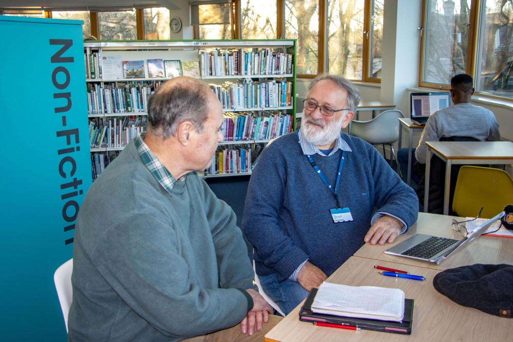 Volunteer digital champion, Mike Watson, providing advice in Dorchester Library Volunteer digital champion, Mike Watson, providing advice in Dorchester Library