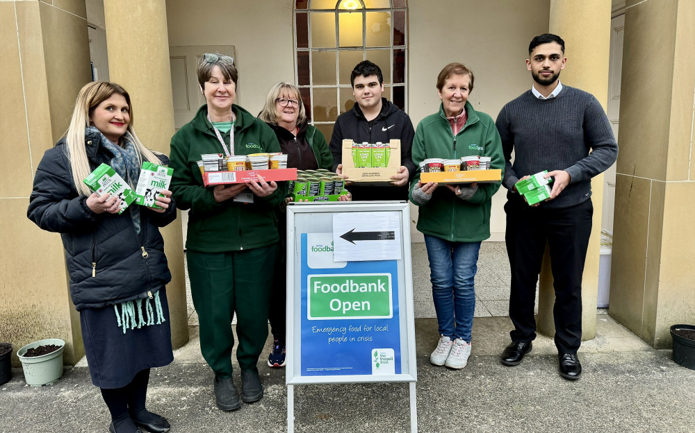 The Ashby Specsavers team with volunteers at the foodbank. Photo: Supplied