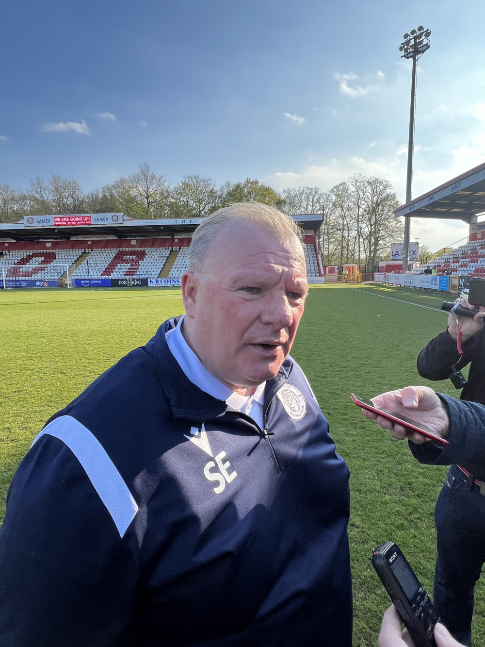 Steve Evans signs new deal at Stevenage FC. PICTURE: Triumphanty Steve Evans speaks with the press including Nub News after Boro clinched promotion to League One last April. CREDIT: @laythy29 