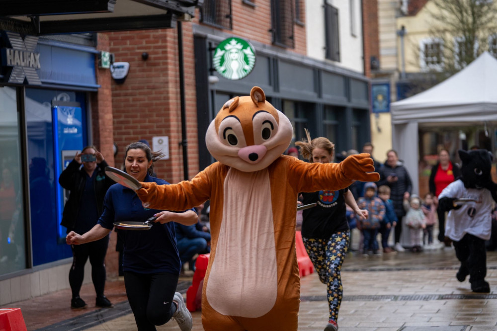 Top that! Letchworth's Pancake Day Race has been hailed as a 'flippin' success. CREDIT: Bezza Visuals