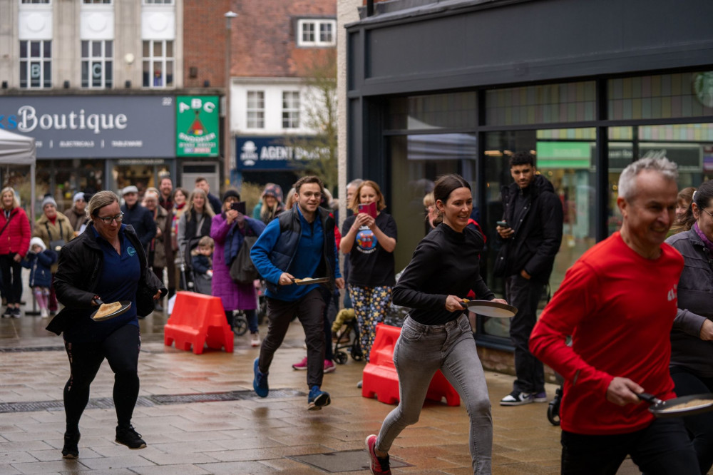 Top that! Letchworth's Pancake Day Race has been hailed as a 'flippin' success. CREDIT: Bezza Visuals