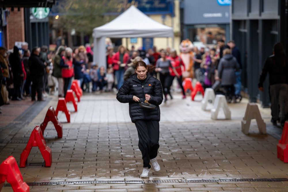 Top that! Letchworth's Pancake Day Race has been hailed as a 'flippin' success. CREDIT: Bezza Visuals