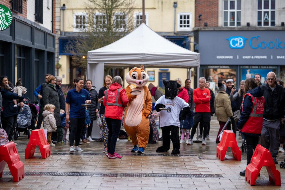 Top that! Letchworth's Pancake Day Race has been hailed as a 'flippin' success. CREDIT: Bezza Visuals