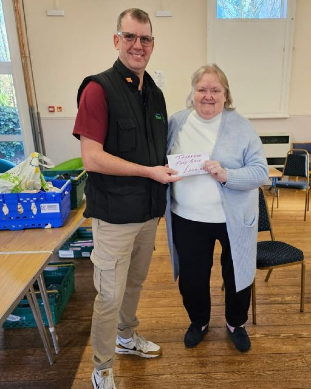 Receiving the gift from Lynne Mansfield was Thurrock Foodbank Operations Manager Peter Newall