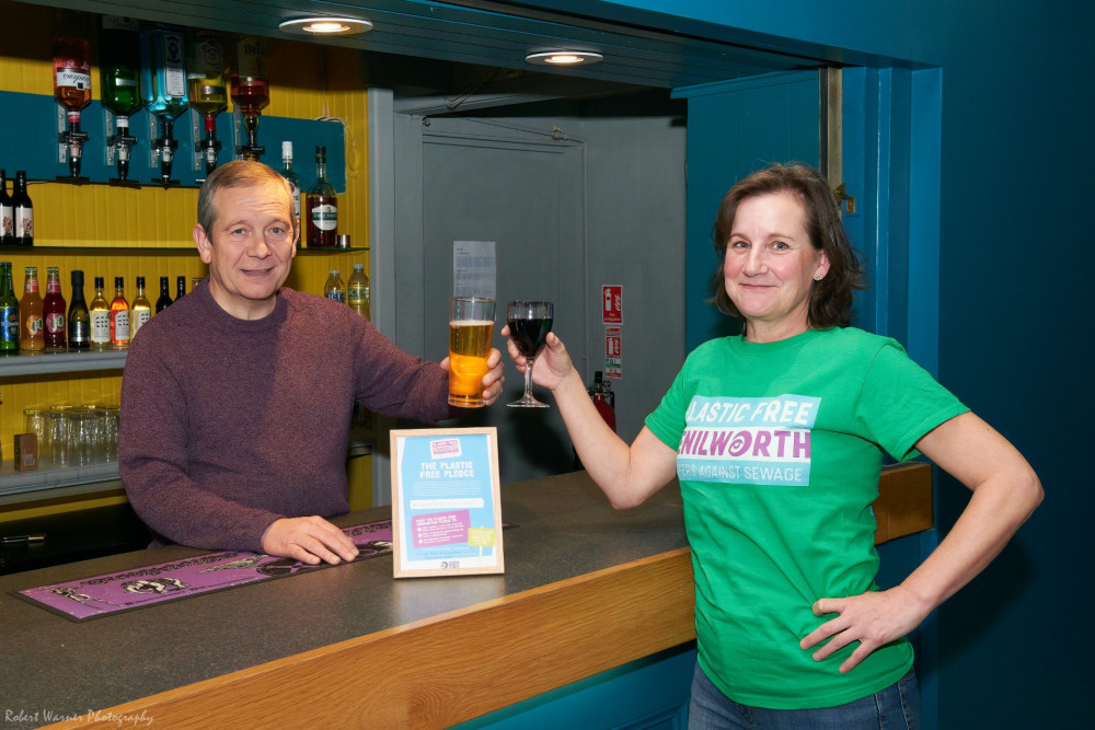 Des McCann, Bar Manager for Talisman Theatre raises a ‘glass’ to celebrate receiving a Plastic-Free Ally Award from Alison Frith, Plastic Free Kenilworth (image by Robert Warner)