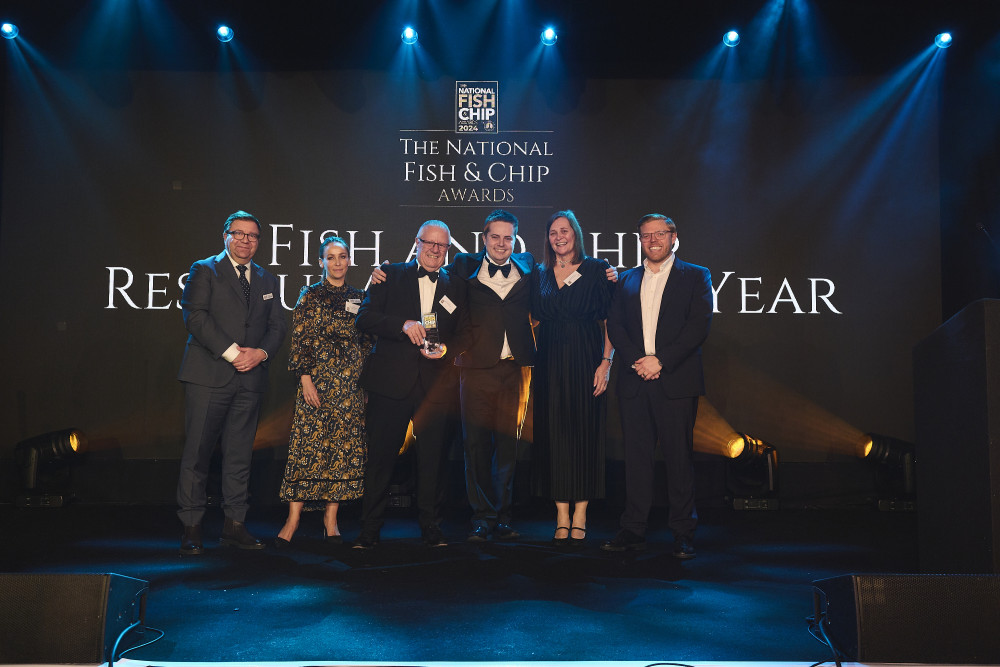 The team collect their trophy at the National Fish and Chip Awards (Credit: National Fish and Chip Awards) 