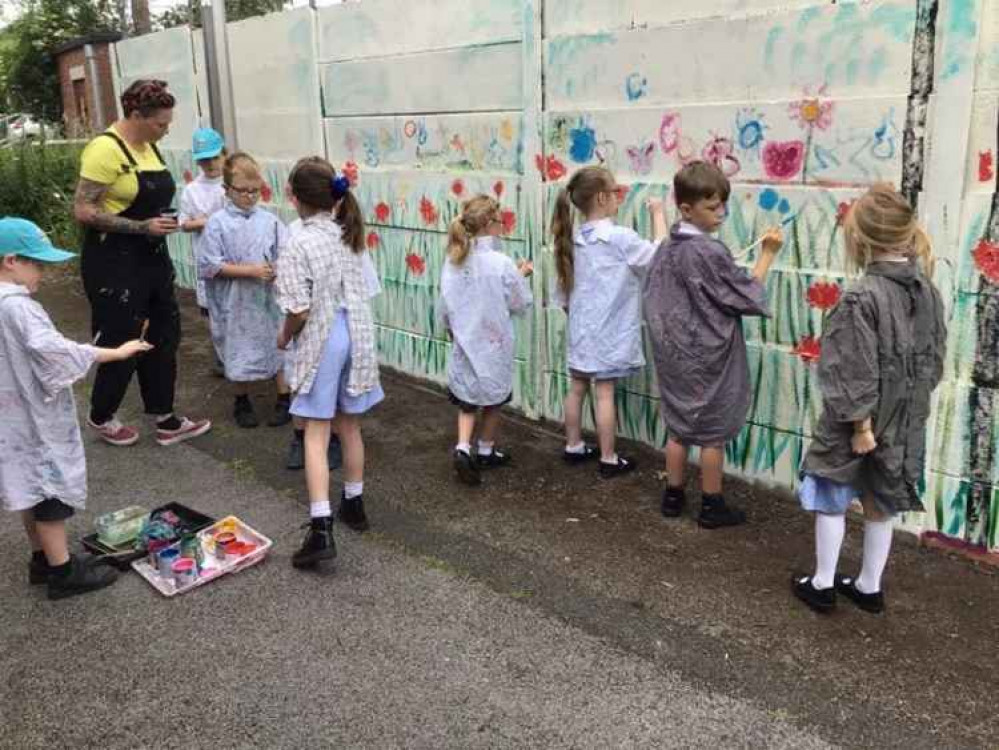 Kingsley St John's pupils work on their wildflower mural. Image courtesy of Kingsley St John's Primary School Kingsley St John's pupils work on their wildflower mural. Image courtesy of Kingsley St John's Primary School