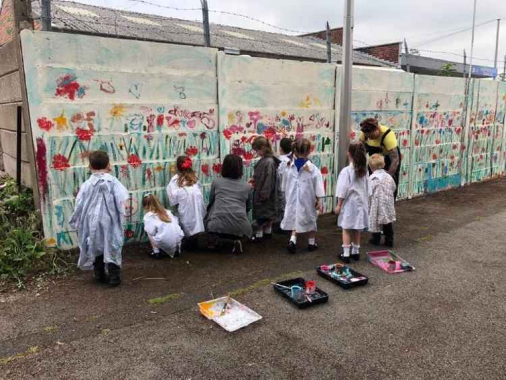Kingsley St John's pupils work on their wildflower mural. Image courtesy of Kingsley St John's Primary School Kingsley St John's pupils work on their wildflower mural. Image courtesy of Kingsley St John's Primary School