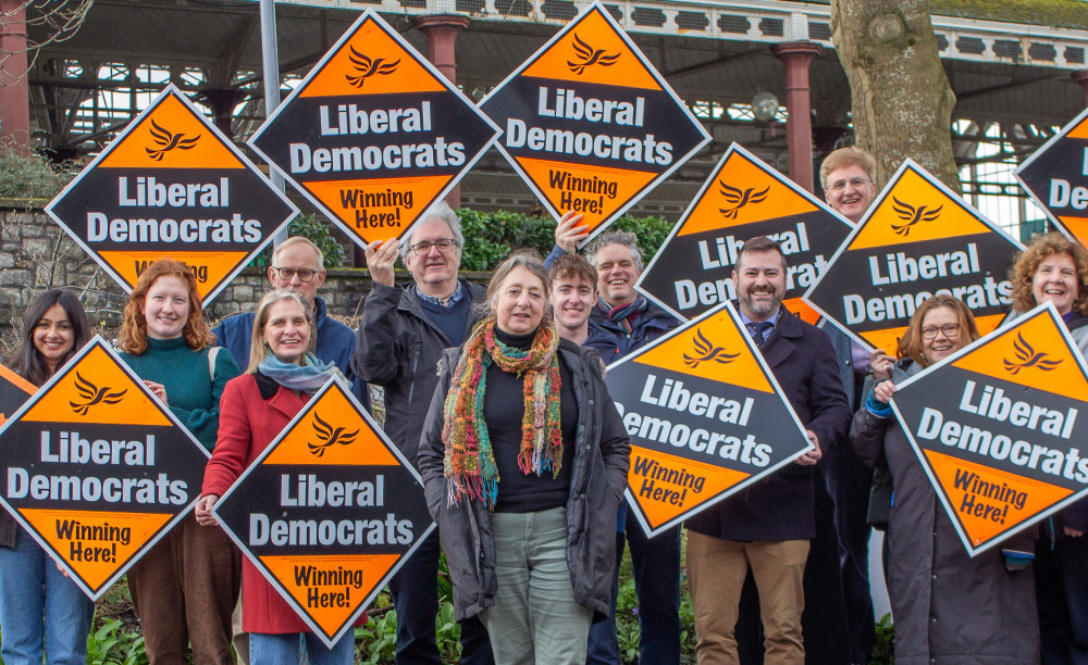 Dine Romero (centre) with Liberal Democrat supporters including Bath MP Wera Hobhouse (centre left) and Bath and North East Somerset Council leader Kevin Guy