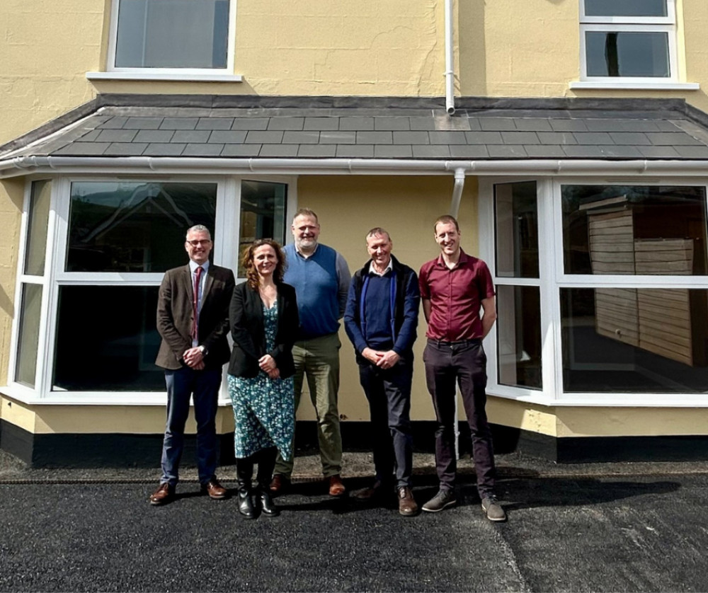 The Weavers Lodge team collecting the keys to the property (Submitted image) 