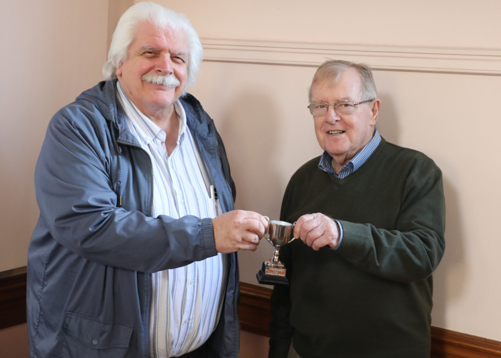 Mike Stone presents trophy to photography winner, Steve Parrot.