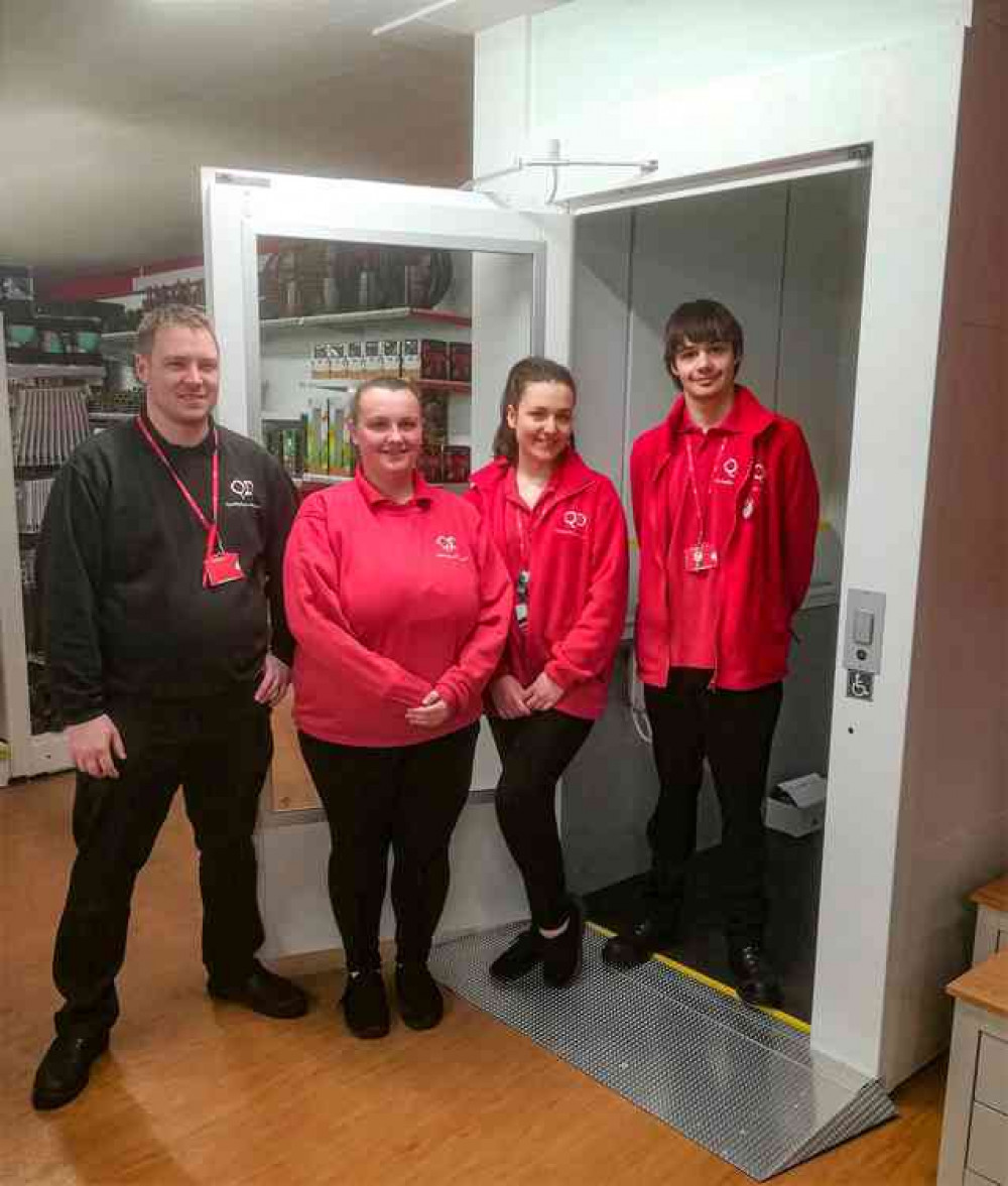 Staff and customers are celebrating the new lift at QD in Church Street Staff and customers are celebrating the new lift at QD in Church Street